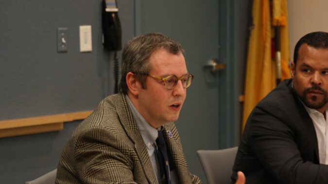 David Bander (left), executive director, Policy Office at New Jersey Department of Labor & Workforce Development, sat down with about 20 business people at NJBIA headquarters for a two-hour question and answer session about the new paid sick leave law. NJBIA’s Michael Wallace listens in.