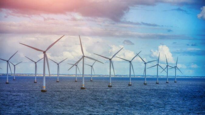 A field of windmills in the open ocean